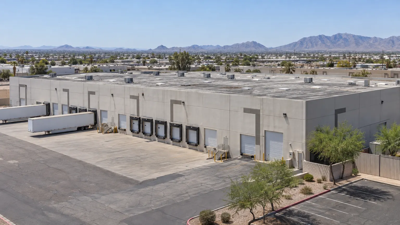 Distribution building with dock doors and an aged flat roof in the West Valley